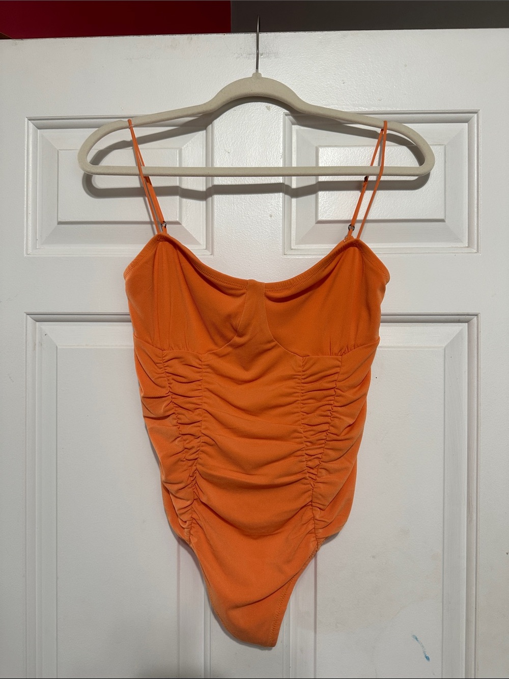 Out from under bodysuit